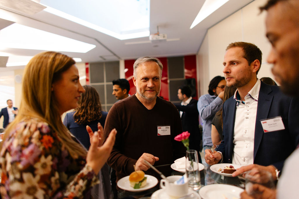 BNI Business Accelerator conversation — members building relationships in Prague